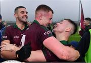 9 October 2022; Portarlington players, from left, Robbie Piggott, Colm Murphy and Jake Foster celebrate after their side's victory in the Laois County Senior Football Championship Final match between O'Dempseys and Portarlington at MW Hire O'Moore Park in Portlaoise, Laois. Photo by Sam Barnes/Sportsfile