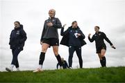 9 October 2022; Louise Quinn with, from left, digital media coordinator Emma Clinton, assistant manager Tom Elms and Niamh Fahey during a Republic of Ireland Women training session at FAI National Training Centre in Abbotstown, Dublin. Photo by Stephen McCarthy/Sportsfile