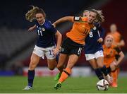 11 October 2022; Katie McCabe of Republic of Ireland in action against Lisa Evans of Scotland during the FIFA Women's World Cup 2023 Play-off match between Scotland and Republic of Ireland at Hampden Park in Glasgow, Scotland. Photo by Stephen McCarthy/Sportsfile