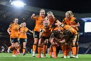 11 October 2022; Amber Barrett of Republic of Ireland, bottom, celebrates with her teammates after scoring their side's first goal during the FIFA Women's World Cup 2023 Play-off match between Scotland and Republic of Ireland at Hampden Park in Glasgow, Scotland. Photo by Mick O'Shea/Sportsfile