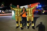 12 October 2022; Republic of Ireland captain Katie McCabe with members of Dublin Airport Fire and Rescue Service Mick Power, left, and David Brennan on the team's return to Dublin Airport after securing their qualification for the FIFA Women's World Cup 2023 in Australia and New Zealand following their play-off victory over Scotland at Hampden Park on Tuesday. Photo by Stephen McCarthy/Sportsfile