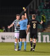 13 October 2022; Daniel Cleary of Shamrock Rovers is shown a yellow card by referee Dario Bel during the UEFA Europa Conference League group F match between Shamrock Rovers and Molde at Tallaght Stadium in Dublin. Photo by Seb Daly/Sportsfile