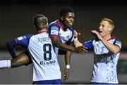 14 October 2022; Serge Atakayi of St Patrick's Athletic, left, celebrates with teammates Chris Forrester, 8, and Eoin Doyle after scoring their side's first goal during the SSE Airtricity League Premier Division match between St Patrick's Athletic and Bohemians at Richmond Park in Dublin. Photo by Seb Daly/Sportsfile