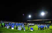 14 October 2022; Players and officials stand for a minute of silence in remembrance of the people who lost their lives in the Creeslough tragedy in Donegal before the SSE Airtricity League Premier Division match between Finn Harps and Dundalk at Finn Park in Ballybofey, Donegal. Photo by Ben McShane/Sportsfile