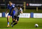 14 October 2022; Ryan O'Kane of Dundalk in action against Gary Boylan of Finn Harps during the SSE Airtricity League Premier Division match between Finn Harps and Dundalk at Finn Park in Ballybofey, Donegal. Photo by Ben McShane/Sportsfile