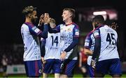 14 October 2022; Chris Forrester, centre, and Barry Cotter of St Patrick's Athletic, left, celebrate their side's third goal, scored by teammate Tunde Owolabi, right, during the SSE Airtricity League Premier Division match between St Patrick's Athletic and Bohemians at Richmond Park in Dublin. Photo by Seb Daly/Sportsfile