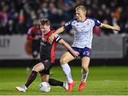 14 October 2022; Conor Levingston of Bohemians in action against Thijs Timmermans of St Patrick's Athletic during the SSE Airtricity League Premier Division match between St Patrick's Athletic and Bohemians at Richmond Park in Dublin. Photo by Seb Daly/Sportsfile