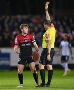 14 October 2022; Referee Adriano Reale shows a yellow card to Conor Levingston of Bohemians during the SSE Airtricity League Premier Division match between St Patrick's Athletic and Bohemians at Richmond Park in Dublin. Photo by Seb Daly/Sportsfile