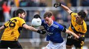 15 October 2022; Ciarán Thompson of Naomh Conaill in action against Darragh Mulgrew, left, and Peter Devine of St Eunan's during the Donegal County Senior Club Football Championship Final between Naomh Conaill and St Eunan's at Páirc Sheáin Mhic Cumhaill in Ballybofey, Donegal. Photo by Piaras Ó Mídheach/Sportsfile