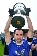 15 October 2022; Naomh Conaill captain Kevin McGettigan lifts the cup after his side's victory in the Donegal County Senior Club Football Championship Final between Naomh Conaill and St Eunan's at Páirc Sheáin Mhic Cumhaill in Ballybofey, Donegal. Photo by Piaras Ó Mídheach/Sportsfile