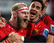 15 October 2022; Jeremy Loughman of Munster celebrates with team-mates Jean Kleyn and Joey Carbery after scoring their side's third try during the United Rugby Championship match between Munster and Vodacom Bulls at Thomond Park in Limerick. Photo by Brendan Moran/Sportsfile