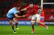 15 October 2022; Thomas Ahern of Munster holds off the tackle of David Kriel of Vodacom Bulls during the United Rugby Championship match between Munster and Vodacom Bulls at Thomond Park in Limerick. Photo by Brendan Moran/Sportsfile