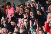 16 October 2022; Treaty United supporters celebrate their side's first goal during the Extra.ie FAI Cup Semi-Final match between Derry City and Treaty United at the Ryan McBride Brandywell Stadium in Derry. Photo by Ramsey Cardy/Sportsfile