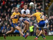 16 October 2022; Conor Rooney of Ratoath is tackled by Ross Ryan and Padraig Jennings of Summerhill during the Meath County Senior Football Championship Final between Ratoath and Summerhill at Páirc Tailteann in Navan, Meath. Photo by Harry Murphy/Sportsfile