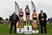 16 October 2022; Athletics Ireland President John Cronin, left, and Mayor of Fingal Councillor Howard Mahony with junior girl's 4500m top three finishers, Avril Millerick of Youghal AC, Cork, first, Jess Norkett of England, second, and Nicole Dinan of Leevale AC, Cork, third, during the Autumn Open International Cross Country Festival at the Sport Ireland Campus in Dublin. Photo by Sam Barnes/Sportsfile