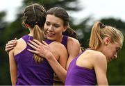 16 October 2022; Abbie Donnelly of England, centre, is congratulated by her Loughborough University team-mates, Grace Carson of Northern Ireland, right, and Alex Millard, left, after competing in the senior women's 6000m during the Autumn Open International Cross Country Festival at the Sport Ireland Campus in Dublin. Photo by Sam Barnes/Sportsfile