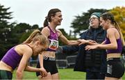 16 October 2022; Abbie Donnelly of England, centre, is congratulated by her Loughborough University team-mates, Grace Carson of Northern Ireland, left, and Alex Millard, right, after competing in the senior women's 6000m during the Autumn Open International Cross Country Festival at the Sport Ireland Campus in Dublin. Photo by Sam Barnes/Sportsfile