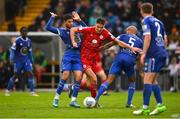 16 October 2022; Sean Boyd of Shelbourne in action against Yassine En-Neyah, left, and Alex Baptiste of Waterford during the Extra.ie FAI Cup Semi-Final match between Waterford FC and Shelbourne at Waterford RSC in Waterford. Photo by Seb Daly/Sportsfile