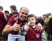 16 October 2022; Paul Finlay of Ballybay, with his son, 9 year old, Aaron celebrate after the Monaghan County Senior Football Championship Final match between Scotstown and Ballybay Pearse Brothers at St Tiernach's Park in Clones, Monaghan. Photo by Philip Fitzpatrick/Sportsfile