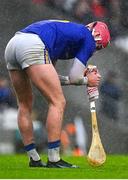 16 October 2022; Ben O'Connor of St Finbarr's attempts to dry his hurley during the Cork County Senior Club Hurling Championship Final match between Blackrock and St Finbarr's at Páirc Ui Chaoimh in Cork. Photo by Eóin Noonan/Sportsfile