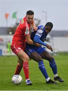 16 October 2022; Sean Boyd of Shelbourne in action against Tunmise Sobowale of Waterford during the Extra.ie FAI Cup Semi-Final match between Waterford and Shelbourne at the RSC in Waterford. Photo by Seb Daly/Sportsfile