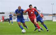 16 October 2022; Sean Boyd of Shelbourne in action against Alex Baptiste, left, and Tunmise Sobowale of Waterford during the Extra.ie FAI Cup Semi-Final match between Waterford and Shelbourne at the RSC in Waterford. Photo by Seb Daly/Sportsfile