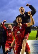 16 October 2022; Stephan Negru, bottom, and Shane Farrell of Shelbourne celebrate after their side's victory in the Extra.ie FAI Cup Semi-Final match between Waterford and Shelbourne at the RSC in Waterford. Photo by Seb Daly/Sportsfile