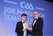 21 October 2022; Antrim hurler Ryan Elliot is presented with his Joe McDonagh Team of the Year for 2022 award by Uachtarán Chumann Lúthchleas Gael Larry McCarthy, right,  during the GAA Champion 15 Awards at Croke Park in Dublin. Photo by Harry Murphy/Sportsfile