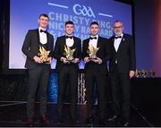21 October 2022; Kildare hurler James Burke, left , Louth hurler Darren Geoghegan, second from left, and Roscommon hurler Daniel Glynn are presented with their Ring, Rackard, and Meagher Team of the Year for 2022 awards by Uachtarán Chumann Lúthchleas Gael Larry McCarthy, right,  during the GAA Champion 15 Awards at Croke Park in Dublin. Photo by Harry Murphy/Sportsfile