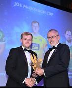 21 October 2022; Antrim hurler Eoghan Campbell, left, is presented with his Joe McDonagh Team of the Year for 2022 award by Uachtarán Chumann Lúthchleas Gael Larry McCarthy during the GAA Champion 15 Awards at Croke Park in Dublin. Photo by Harry Murphy/Sportsfile