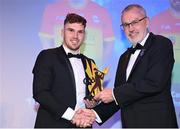 21 October 2022; Carlow hurler Chris Nolan, left, is presented with his Joe McDonagh Team of the Year for 2022 award by Uachtarán Chumann Lúthchleas Gael Larry McCarthy during the GAA Champion 15 Awards at Croke Park in Dublin. Photo by Harry Murphy/Sportsfile