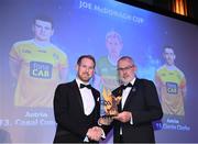 21 October 2022; Kerry hurler Pádraig Boyle, left, is presented with his Joe McDonagh Team of the Year for 2022 award by Uachtarán Chumann Lúthchleas Gael Larry McCarthy during the GAA Champion 15 Awards at Croke Park in Dublin. Photo by Harry Murphy/Sportsfile