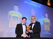 21 October 2022; Antrim hurler Conal Cunning, left, is presented with his Joe McDonagh Team of the Year for 2022 award by Uachtarán Chumann Lúthchleas Gael Larry McCarthy during the GAA Champion 15 Awards at Croke Park in Dublin. Photo by Harry Murphy/Sportsfile