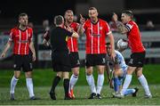 21 October 2022; Derry City players, from left, Cameron Dummigan, Mark Connolly, Shane McEleney and Patrick McEleney appeal to Referee Derek Tomney during the SSE Airtricity League Premier Division match between Derry City and Shelbourne at The Ryan McBride Brandywell Stadium in Derry. Photo by Ramsey Cardy/Sportsfile