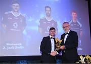 21 October 2022; Westmeath footballer Jack Smith is presented with his Tailteann Cup Team of the Year for 2022 award by Uachtarán Chumann Lúthchleas Gael Larry McCarthy  during the GAA Champion 15 Awards at Croke Park in Dublin. Photo by Harry Murphy/Sportsfile