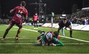 21 October 2022; Mack Hansen of Connacht scores his side's second try despite the tackle from Sam Costelow of Scarlets during the United Rugby Championship match between Connacht and Scarlets at The Sportsground in Galway. Photo by David Fitzgerald/Sportsfile