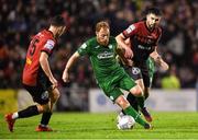 21 October 2022; Ryan Connolly of Finn Harps in action against James Clarke, left, and Jordan Flores of Bohemians during the SSE Airtricity League Premier Division match between Bohemians and Finn Harps at Dalymount Park in Dublin. Photo by Tyler Miller/Sportsfile