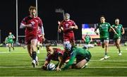 21 October 2022; Mack Hansen of Connacht scores his side's fourth try despite the efforts of Johnny McNicholl of Scarlets during the United Rugby Championship match between Connacht and Scarlets at The Sportsground in Galway. Photo by Brendan Moran/Sportsfile