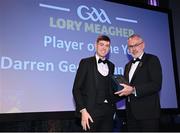 21 October 2022; Louth hurler Darren Geoghegan receives the Lory Meagher player of the year award from Uachtarán Chumann Lúthchleas Gael Larry McCarthy during the GAA Champion 15 Awards at Croke Park in Dublin. Photo by Harry Murphy/Sportsfile