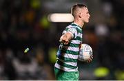 21 October 2022; Andy Lyons of Shamrock Rovers removes an object from the pitch during the SSE Airtricity League Premier Division match between Shamrock Rovers and St Patrick's Athletic at Tallaght Stadium in Dublin. Photo by Seb Daly/Sportsfile