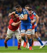 22 October 2022; Max Deegan of Leinster is tackled by John Hodnett of Munster during the United Rugby Championship match between Leinster and Munster at Aviva Stadium in Dublin. Photo by Ramsey Cardy/Sportsfile