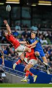 22 October 2022; Jack Crowley and Liam Coombes of Munster contest a high ball with Garry Ringrose of Leinster during the United Rugby Championship match between Leinster and Munster at Aviva Stadium in Dublin. Photo by Harry Murphy/Sportsfile
