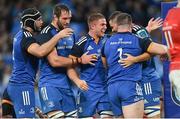 22 October 2022; Scott Penny of Leinster, centre, celebrates with teammates after scoring their first try during the United Rugby Championship match between Leinster and Munster at Aviva Stadium in Dublin. Photo by Ramsey Cardy/Sportsfile