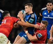 22 October 2022; Garry Ringrose of Leinster is tackled by Jack O'Sullivan and Gavin Coombes of Munster during the United Rugby Championship match between Leinster and Munster at Aviva Stadium in Dublin. Photo by Harry Murphy/Sportsfile