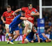 22 October 2022; Ruadhan Quinn of Munster is tackled by Caelan Doris of Leinster during the United Rugby Championship match between Leinster and Munster at Aviva Stadium in Dublin. Photo by Ramsey Cardy/Sportsfile