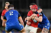 22 October 2022; John Hodnett of Munster is tackled by Dan Sheehan, left, and Andrew Porter of Leinster during the United Rugby Championship match between Leinster and Munster at Aviva Stadium in Dublin. Photo by Ramsey Cardy/Sportsfile