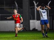22 October 2022; Andrew Kehoe of Palatine celebrates scoring his side's second goal as Niall Delahunt of St Patrick's reacts during the AIB Leinster GAA Football Senior Club Championship Round 1 match between Palatine and St Patrick's at Netwatch Cullen Park in Carlow. Photo by Piaras Ó Mídheach/Sportsfile