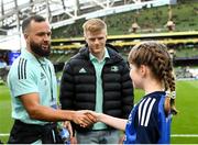 22 October 2022; Matchday mascot Maria McCarthy meets Jamison Gibson-Park at the United Rugby Championship match between Leinster and Munster at Aviva Stadium in Dublin. Photo by Harry Murphy/Sportsfile