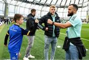 22 October 2022; Mascot Cormac de Búrca with Leinster players, from left, Jordan Larmour, Tommy O'Brien and Jamison Gibson-Park at the United Rugby Championship match between Leinster and Munster at Aviva Stadium in Dublin. Photo by Harry Murphy/Sportsfile