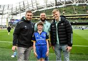22 October 2022; Mascot Maria McCarthy with Leinster players, from left, Jordan Larmour, Jamison Gibson-Park and Tommy O'Brien at the United Rugby Championship match between Leinster and Munster at Aviva Stadium in Dublin. Photo by Harry Murphy/Sportsfile